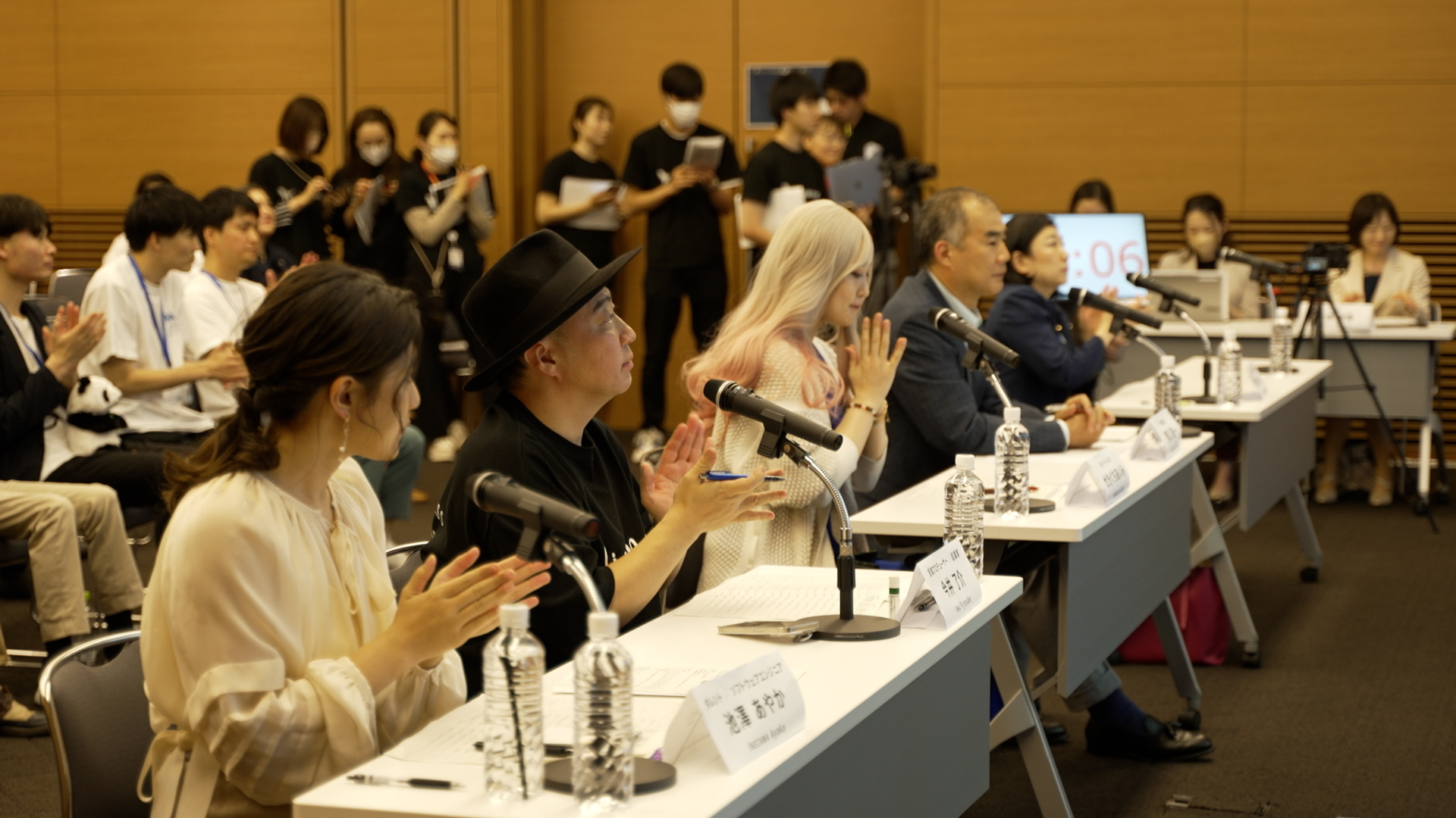 A special committee member listens to the group's presentation.