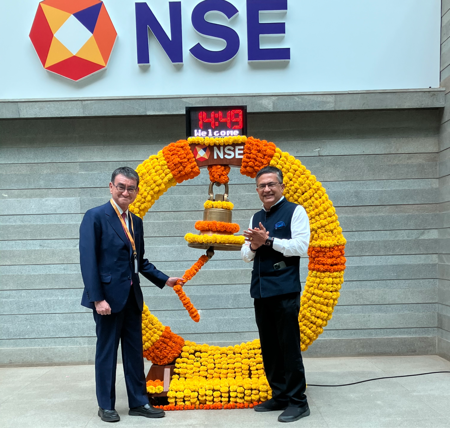Minister Kono ringing the bell of the National Stock Exchange of India.