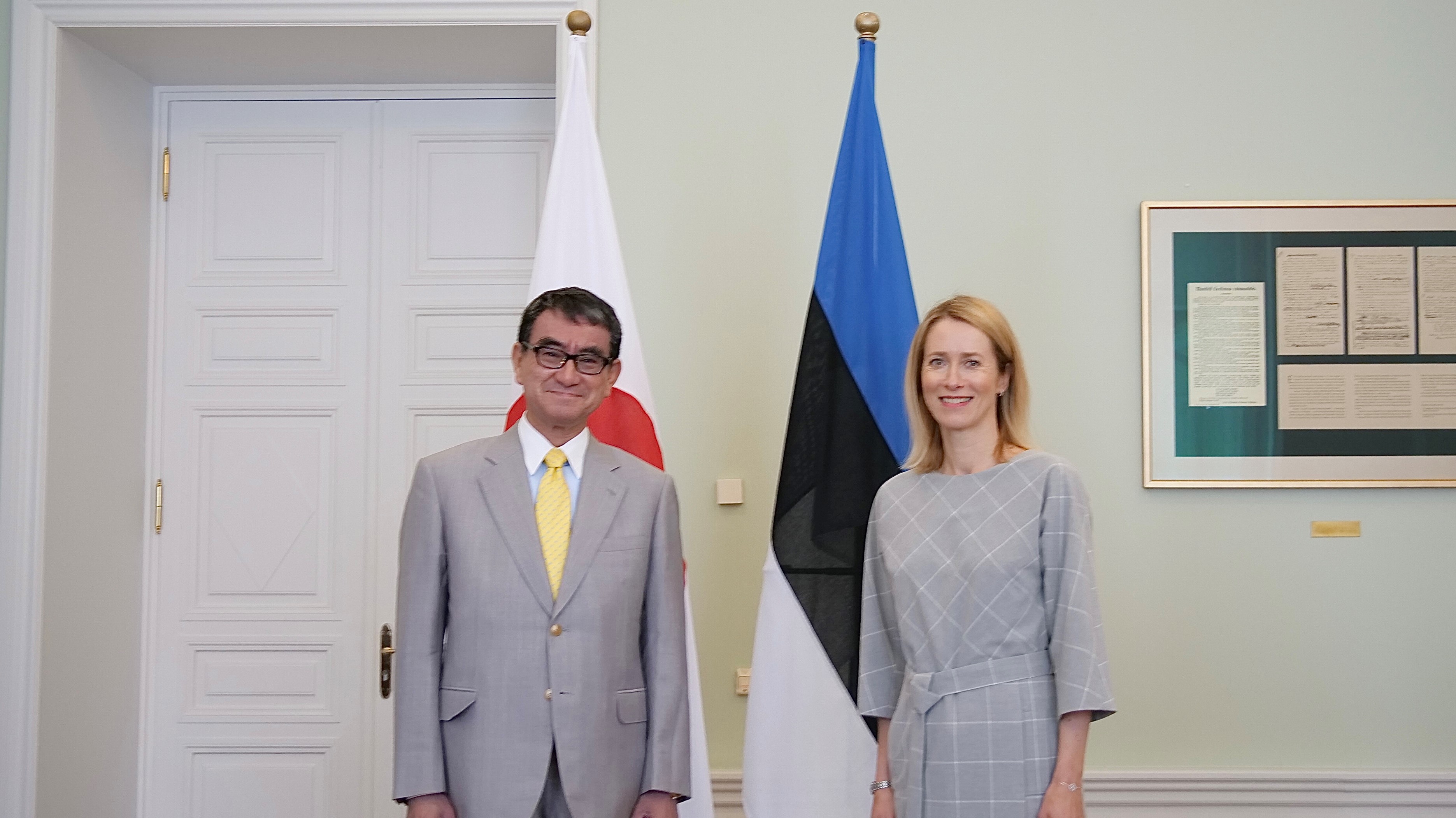 Photo of Ms. Kaja Kallas, Prime Minister of the Republic of Estonia (right) and Minister Kono (left) standing.
