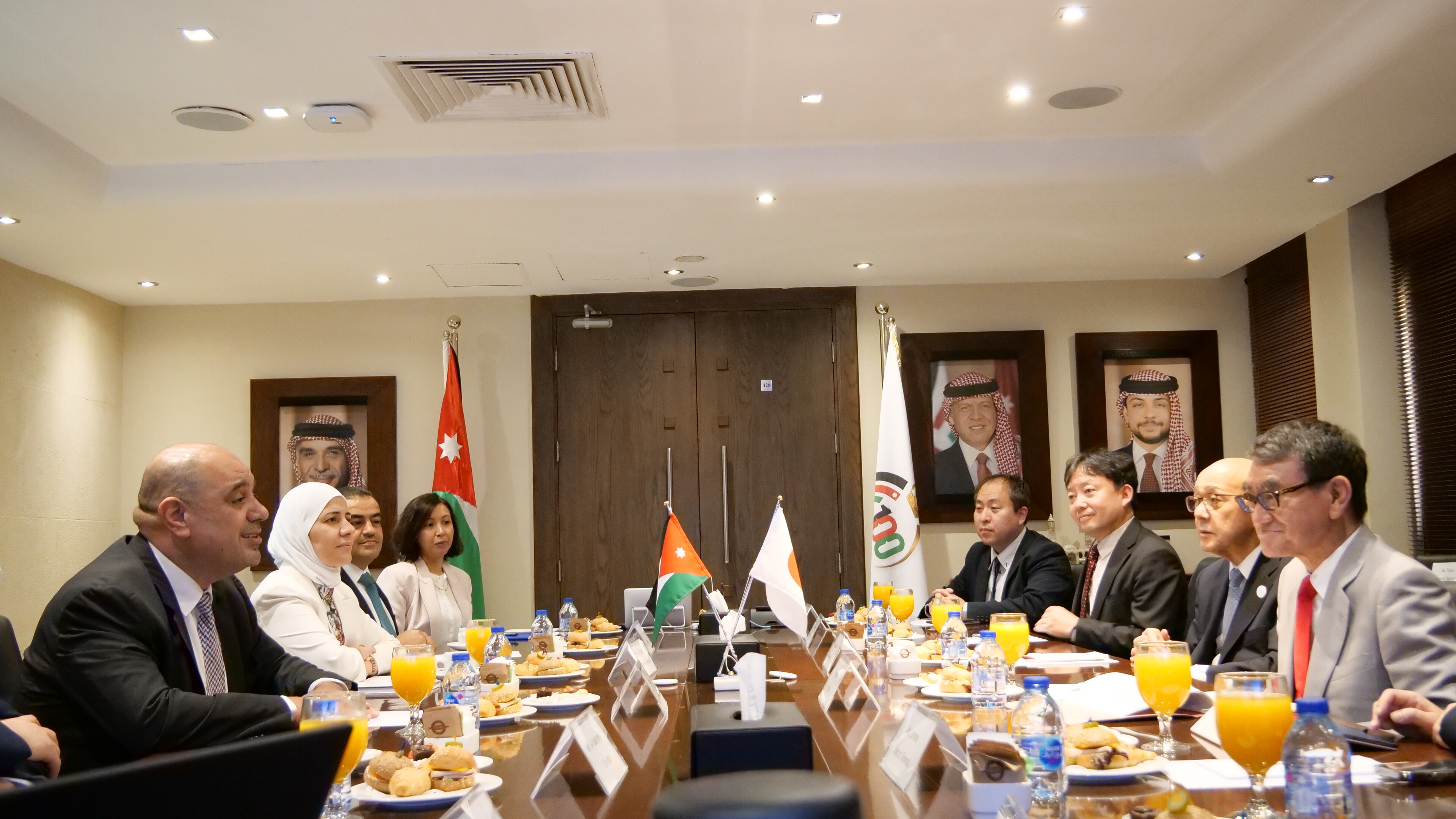 Photo of the meeting. Minister Al-Hanandeh sits on the left and Minister Kono sits on the right.
