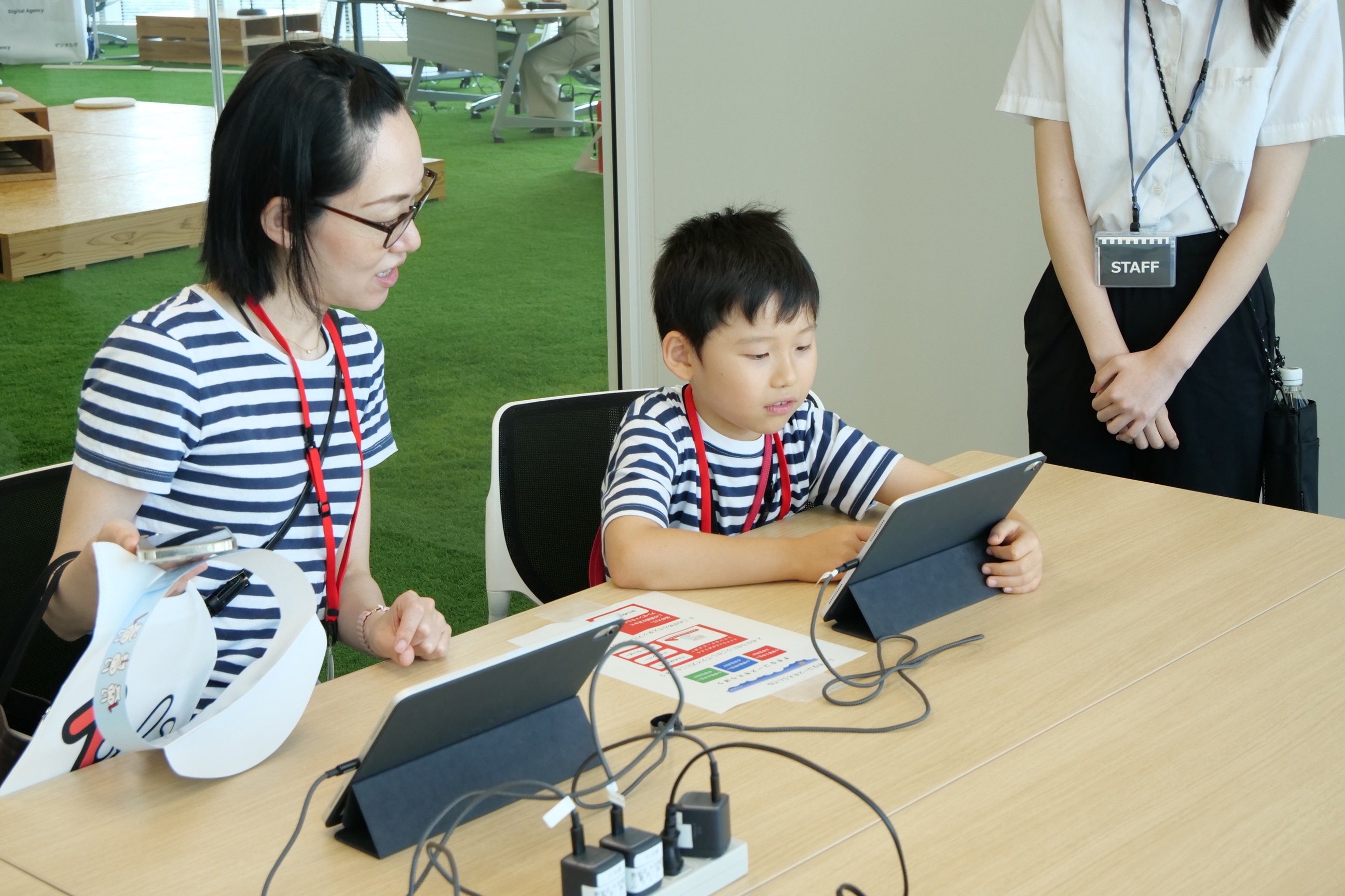 Dependents and Parents Using Tablets to Take Quizzes