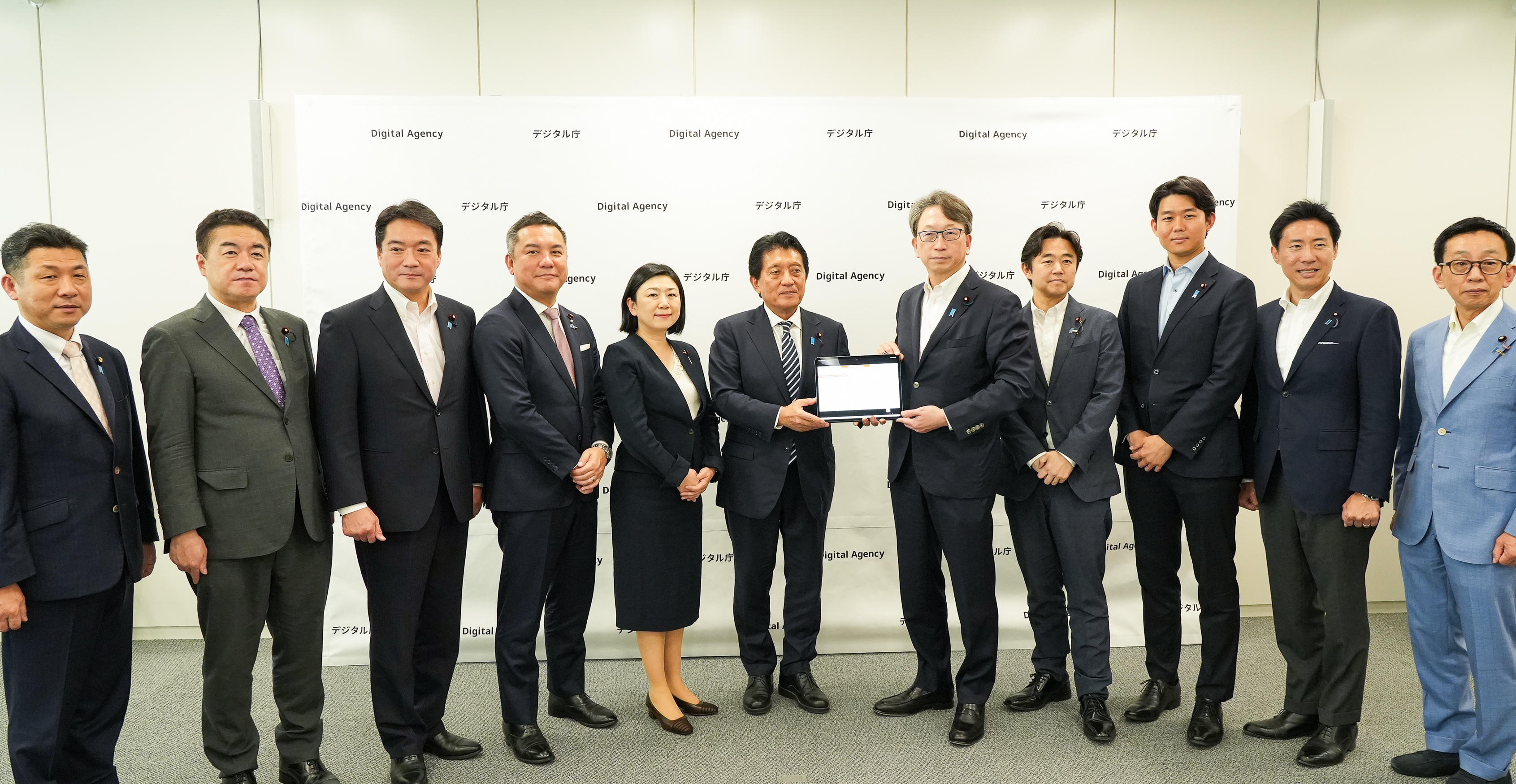 Including Mr. Taira, Minister for Digital Transformation,, Digital Agency and members of the Liberal Democratic Party are shown side by side.