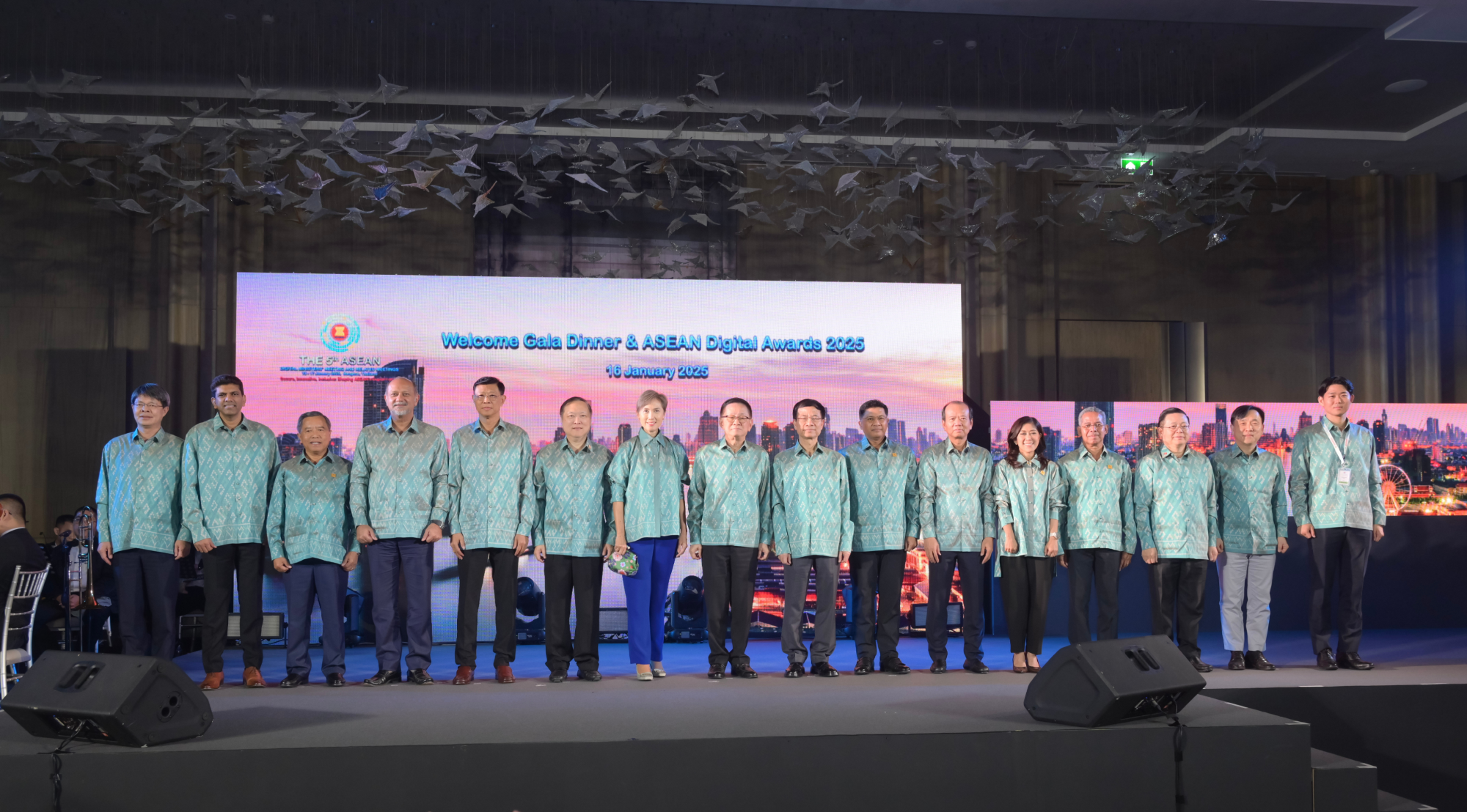 Japanese and ASEAN representatives are shown standing on the stage, with Mr. Kishi, Parliamentary Vice-Minister for Digital Transformation, standing on the far right. 